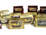 many different types of toy trains and trucks in boxes