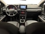 the interior of a car with a steering wheel, dashboard, and dashboard controls