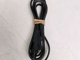 a black cord that is connected to a black charger