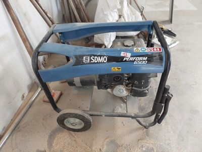 a blue machine that is sitting in the garage