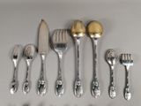 a lot of silver spoons and forks on the table