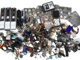 a pile of assorted items that are on a white surface