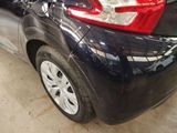 a picture of a black car with a red tail light