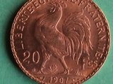 an image of a coin with a rooster on it on a green surface