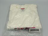 the white t - shirt is wrapped in plastic and ready to be shipped