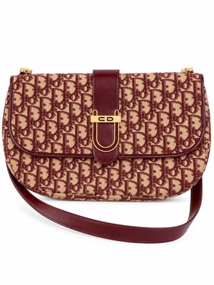 a brown and tan purse with a brown strap