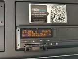 a close up of a car radio with qr code on it