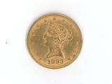l'image d'une pièce d'or sur laquelle figure une tête de femme