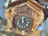 a clock that is hanging from the ceiling of a room