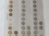 a lot of coins in a plastic bag on a table