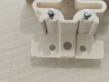 a close up of a pair of white electrical connectors on a table