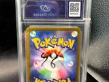 a close up of a pokemon card in a clear case