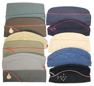 several hats are lined up in a row on a white surface