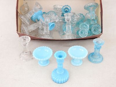 a box full of blue glass items on a table