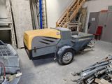a small machine that is parked in a garage