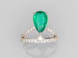 a pear shaped emerald and diamond ring
