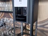 bottles and glasses are lined up on the bar at a restaurant