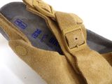 a close up of a pair of shoes on a white surface