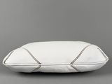 a white pillow on a grey background