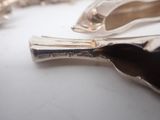 two spoons and a fork sitting on a table