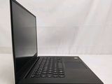 the laptop is open on a white surface with a white background