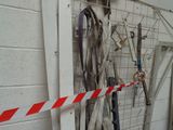 an image of a room with a bunch of tools hanging on the wall