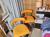 a room with a bed, desk, and chair in it