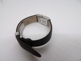 an image of a wrist watch on a white surface with a black strap