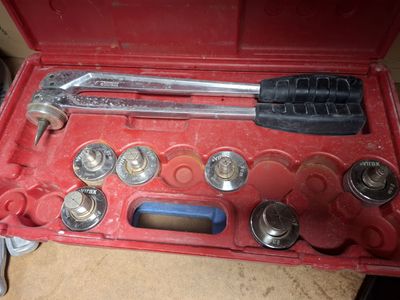 a tool set in a red case on a table