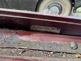 a close up of a rusted car with a number plate on it