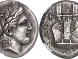 a silver coin with a woman ' s face and a cross on it