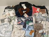 many different types of clothing on the table together