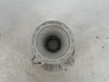 a white toilet bowl with a black lid in the snow