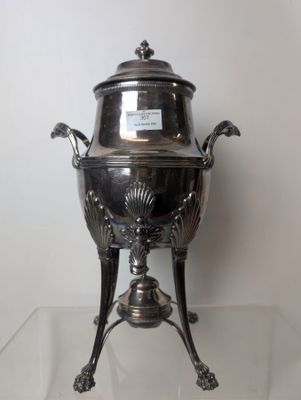 a silver plate with a lid on a stand