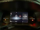the dashboard of a car with a digital display in the center of it