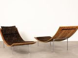 pair of lounge chairs in the style of hans j wegnel