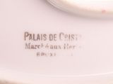 a white plate that has a picture of a cat on it