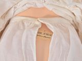 a close up of a white dress with a label on it