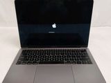 an apple macbook pro laptop computer sitting on top of a white surface