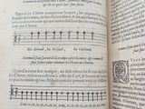 an open book with music notations on it