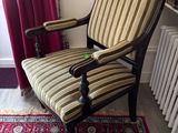 a chair that is sitting in front of a radiator