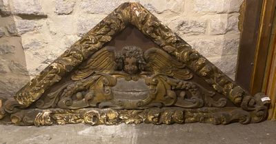 a statue of an angel on the corner of a building