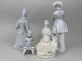 three figurines that are sitting next to each other