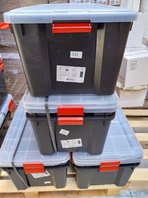 several plastic storage boxes stacked on top of each other on a pallet