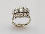 a white gold ring set with three round brilliant cut diamonds