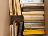 a box full of books that are sitting on the floor