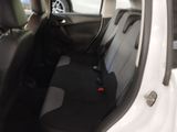 a white car with black seats in the back of it