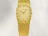 an image of a gold watch with diamonds on the face