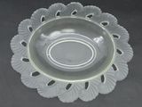 a clear glass bowl with a decorative design on it