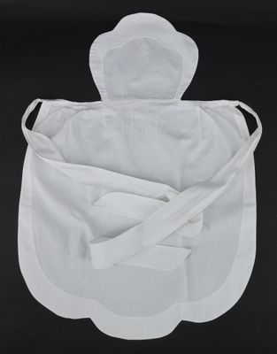 a close up of a white apron on a black background